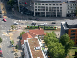 A tram at the northbound platform seen from the Rheinturm observation tower