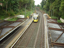 Looking down to the platforms as a tram being used for driver training passes heading to Bury