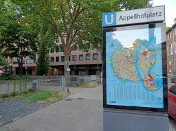 The railings around the northern-most entrance can be seen to the left of this sign