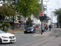 The westbound platform and the entrance to the underground station for north- and southbound which serves it