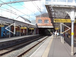 Panorama of the platform for trams to Manchester and one end of the platform for trams to Altrincham