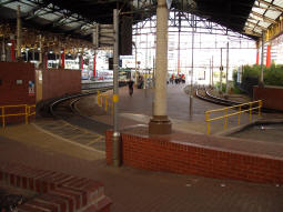 Looking across to the island platform, with a tram to Bury via Woodlands Road at the platform