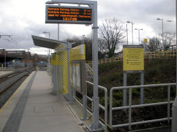 Looking along the platform for trams to Rochdale at the stairs entrance from Elizabethan Way
