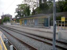 The platform for trams to East Didsbury from the ramp up to the other platform
