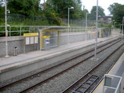 The platform for trams to East Didsbury from the final set of steps down to the other platform