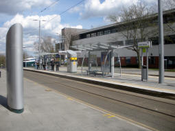 Looking across to the island platform (trams to city centre side nearest) from by a ticket machine on the pavement