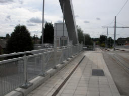 The lift and stairs down from the bridge on the other side of the A52 from the stop