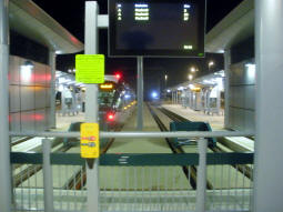 The tram and bus departure display at the end of the line at night
