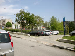 The small car park with the tram stop in the background