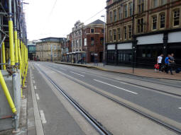 Looking across the tracks/street to the platform for trams to Middlewood or Malin Bridge