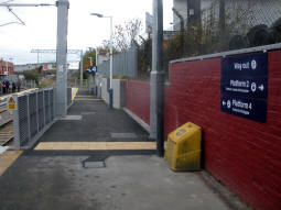 Approaching the platform for trams to Parkgate from one of the railway platforms